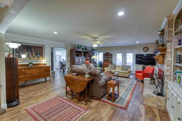 Fireplace, Interior, Living room, Recessed Lighting, Stone Walls, Wood Texture Flooring