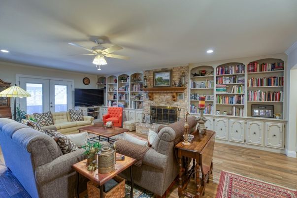 Fireplace, Interior, Living room, Recessed Lighting, Stone Walls, Wood Texture Flooring