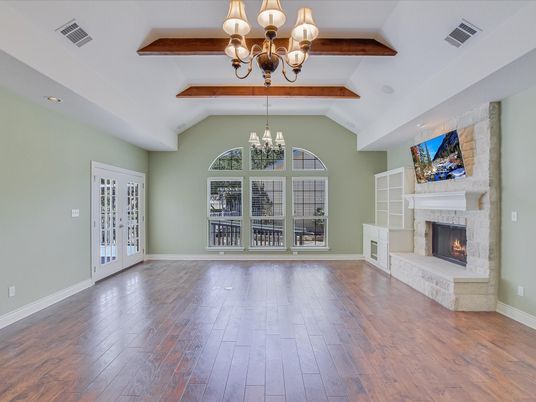 Chandelier, Empty room, Fireplace, Interior, Recessed Lighting, Wooden Beams, Wood Texture Flooring