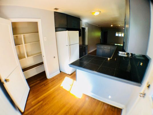Interior, Kitchen, Recessed Lighting, Tile Countertops, Wood Texture Flooring