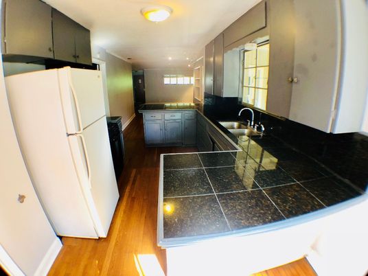 Interior, Kitchen, Recessed Lighting, Tile Countertops, Wood Texture Flooring