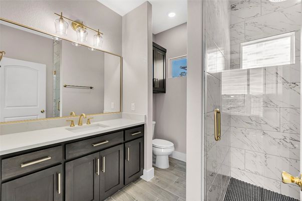 Bathroom, Glass Shower, Interior, Marble Walls, Recessed Lighting, Wood Texture Flooring