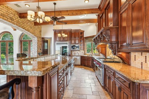 Chandelier, Interior, Kitchen, Recessed Lighting, Stainless Steel Appliances, Stone Walls, Wooden Beams