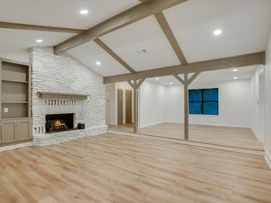 Empty room, Fireplace, Interior, Recessed Lighting, Stone Walls, Wooden Beams, Wood Texture Flooring