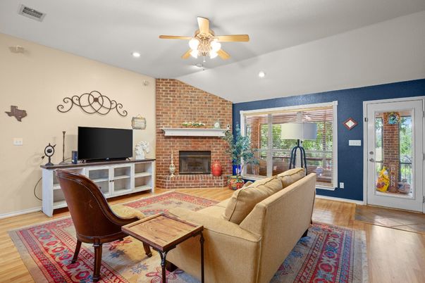 Fireplace, Interior, Living room, Recessed Lighting, Stone Walls, Wood Texture Flooring