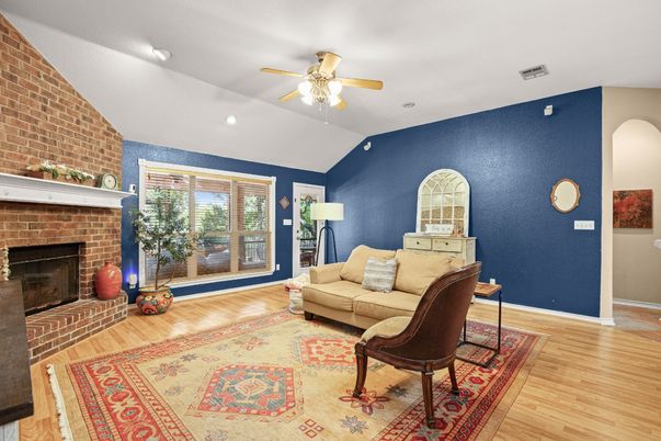 Fireplace, Interior, Living room, Recessed Lighting, Stone Walls, Wood Texture Flooring