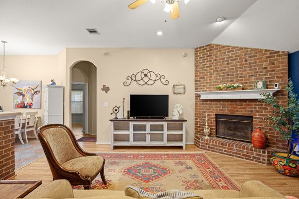 Chandelier, Fireplace, Interior, Recessed Lighting, Stone Walls, Wood Texture Flooring