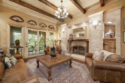 Chandelier, Fireplace, Interior, Living room, Stone Walls, Wooden Beams, Wood Texture Flooring