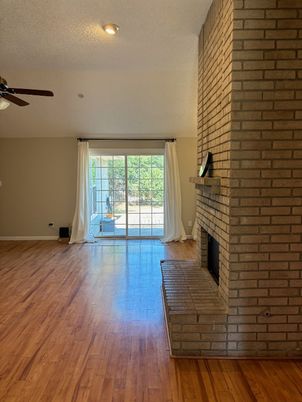 Empty room, Fireplace, Interior, Recessed Lighting, Stone Walls, Wood Texture Flooring