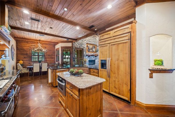 Chandelier, Dining room, Fireplace, Interior, Kitchen, Recessed Lighting, Stainless Steel Appliances, Wooden Beams, Wooden Ceilings, Wooden Walls