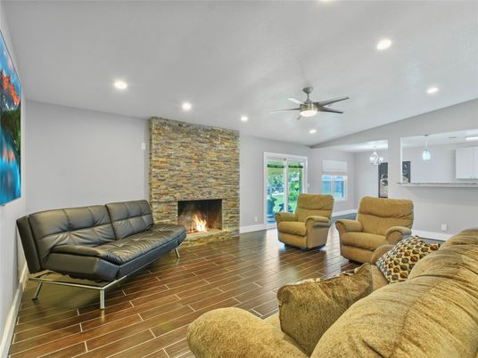 Fireplace, Interior, Living room, Pendant Lights, Recessed Lighting, Stone Walls, Wood Texture Flooring