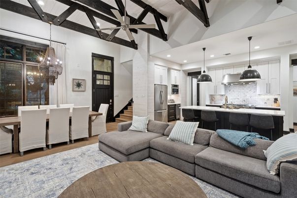 Chandelier, Dining room, Interior, Kitchen, Living room, Pendant Lights, Recessed Lighting, Stainless Steel Appliances, Wooden Beams, Wood Texture Flooring