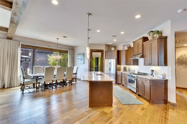 Dining room, Interior, Kitchen, Pendant Lights, Recessed Lighting, Stainless Steel Appliances, Wood Texture Flooring