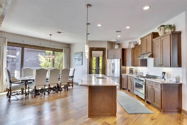 Dining room, Interior, Kitchen, Pendant Lights, Recessed Lighting, Stainless Steel Appliances, Wood Texture Flooring
