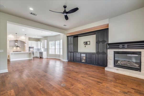 Empty room, Fireplace, Interior, Kitchen, Pendant Lights, Recessed Lighting, Wood Texture Flooring