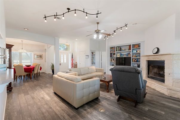 Dining room, Fireplace, Interior, Living room, Pendant Lights, Recessed Lighting, Wood Texture Flooring