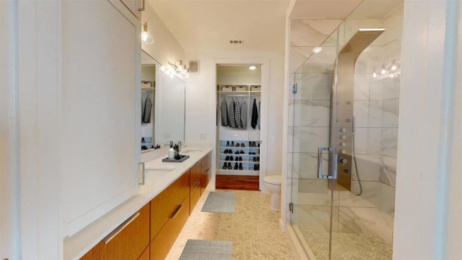 Bathroom, Dual Sink Vanities, Glass Shower, Interior, Marble Walls, Recessed Lighting, Walk-in Closets, Wood Texture Flooring