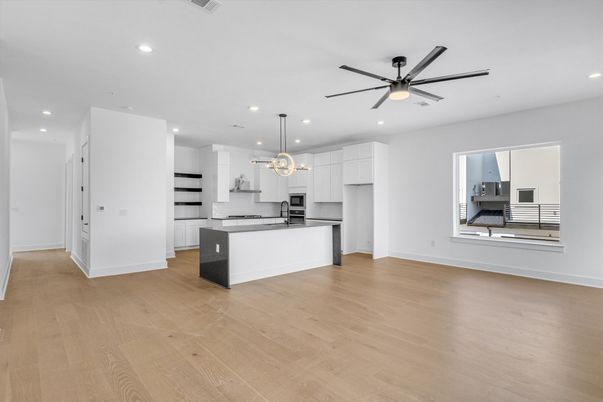 Empty room, Interior, Kitchen, Pendant Lights, Recessed Lighting, Stainless Steel Appliances, Wood Texture Flooring