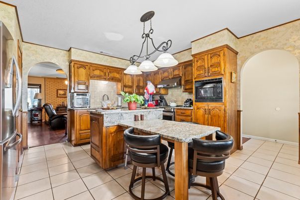 Interior, Kitchen, Pendant Lights, Stainless Steel Appliances, Stone Walls