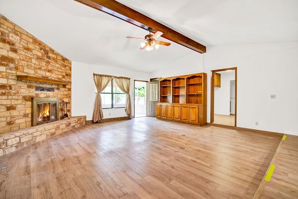 Empty room, Fireplace, Interior, Stone Walls, Wooden Beams, Wood Texture Flooring