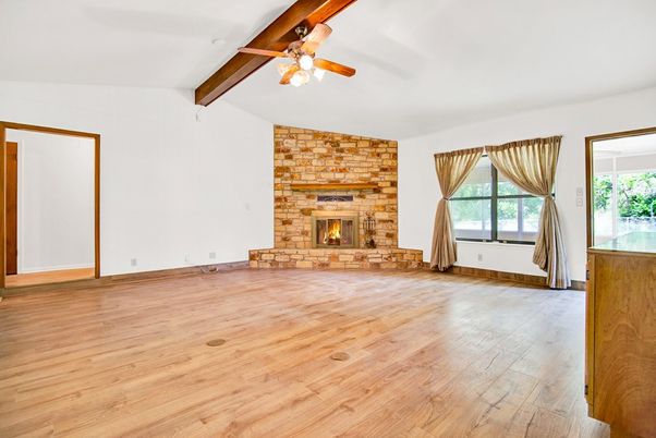 Empty room, Fireplace, Interior, Stone Walls, Wooden Beams, Wood Texture Flooring
