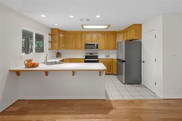 Interior, Kitchen, Recessed Lighting, Stainless Steel Appliances, Wood Texture Flooring