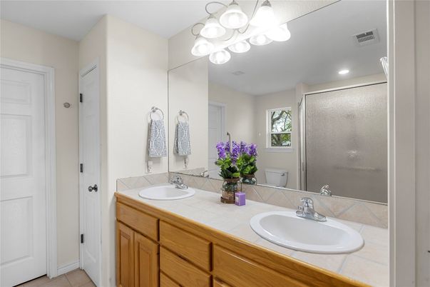 Bathroom, Dual Sink Vanities, Glass Shower, Interior, Recessed Lighting, Tile Countertops