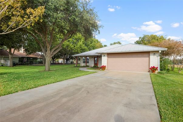 Attached, Backyard, Exterior, Facade, Brick Facade, Ranch