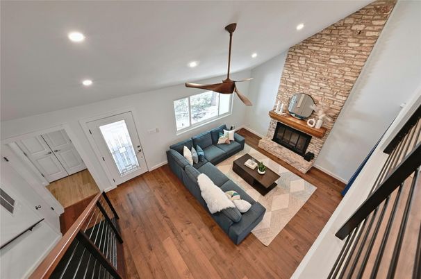 Fireplace, Interior, Living room, Recessed Lighting, Stone Walls, Wood Texture Flooring