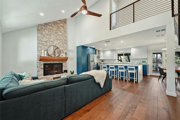 Dining room, Fireplace, Interior, Kitchen, Living room, Recessed Lighting, Stainless Steel Appliances, Stone Walls, Wood Texture Flooring