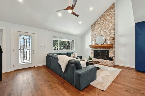 Fireplace, Interior, Living room, Recessed Lighting, Stone Walls, Wood Texture Flooring