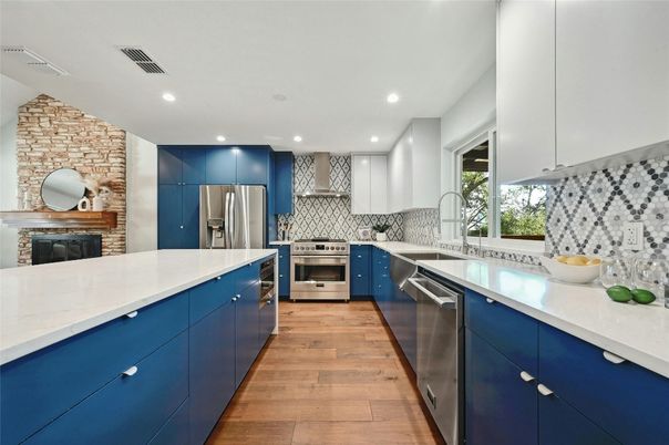 Fireplace, Interior, Kitchen, Recessed Lighting, Stainless Steel Appliances, Stone Walls, Wood Texture Flooring