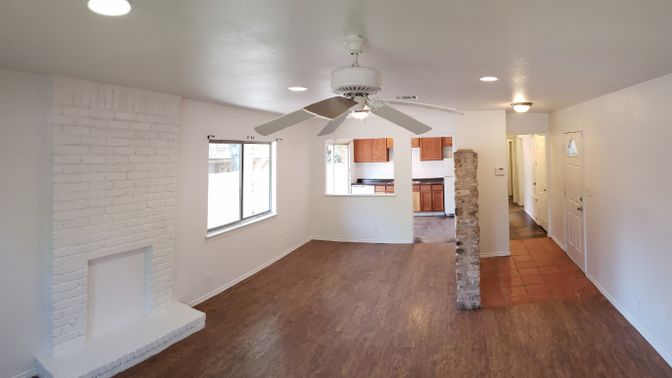 Empty room, Fireplace, Interior, Recessed Lighting, Stone Walls, Wood Texture Flooring