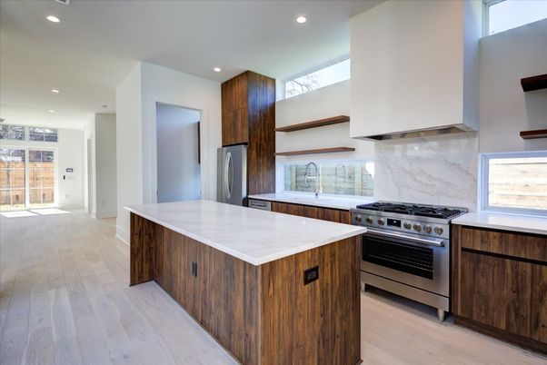 Interior, Kitchen, Marble Walls, Recessed Lighting, Stainless Steel Appliances, Wood Texture Flooring