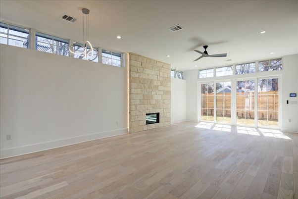 Empty room, Fireplace, Interior, Pendant Lights, Recessed Lighting, Stone Walls, Wood Texture Flooring