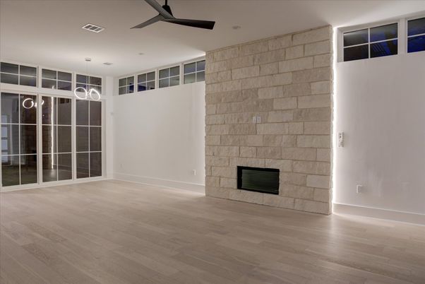 Empty room, Fireplace, Interior, Pendant Lights, Recessed Lighting, Stone Walls, Wood Texture Flooring