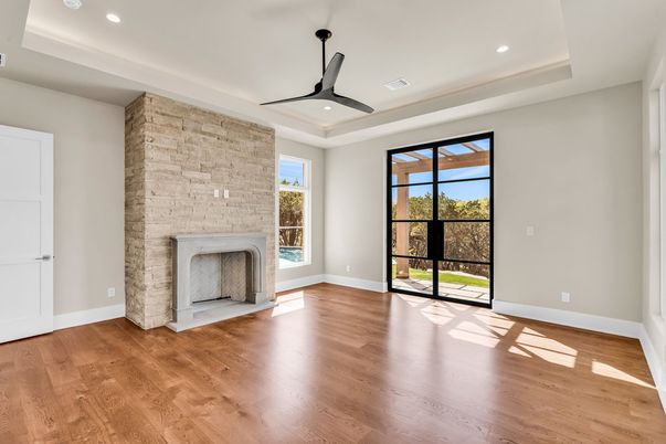 Empty room, Fireplace, Interior, Recessed Lighting, Stone Walls, Wood Texture Flooring