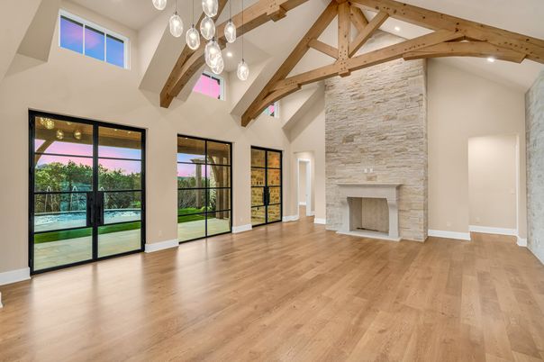Empty room, Fireplace, Interior, Pendant Lights, Recessed Lighting, Stone Walls, Wooden Beams, Wood Texture Flooring