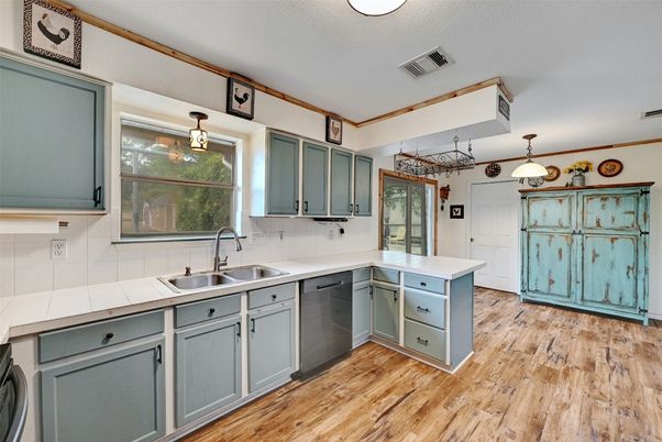 Interior, Kitchen, Pendant Lights, Tile Countertops, Wood Texture Flooring