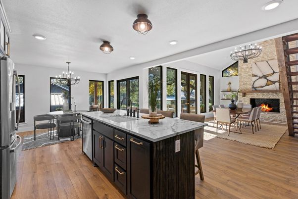 Chandelier, Dining room, Fireplace, Interior, Kitchen, Living room, Pendant Lights, Recessed Lighting, Stone Walls, Wood Texture Flooring