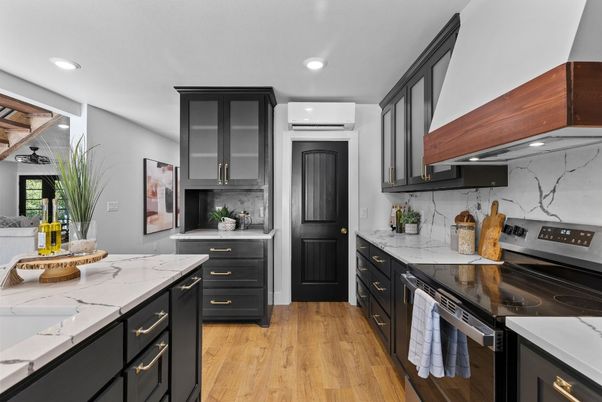 Interior, Kitchen, Marble Walls, Recessed Lighting, Stainless Steel Appliances, Wood Texture Flooring