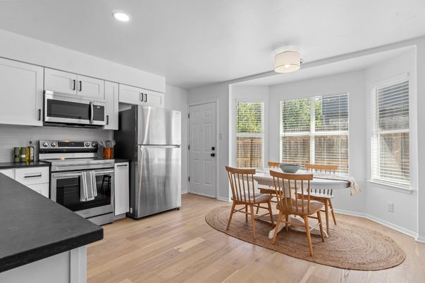Dining room, Interior, Kitchen, Recessed Lighting, Stainless Steel Appliances, Wood Texture Flooring
