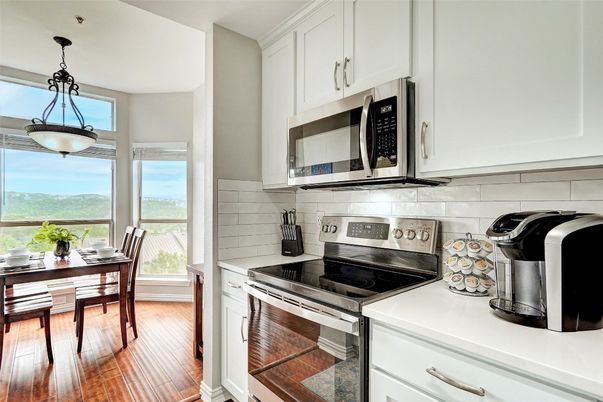 Dining room, Interior, Kitchen, Pendant Lights, Stainless Steel Appliances, Water, Wood Texture Flooring