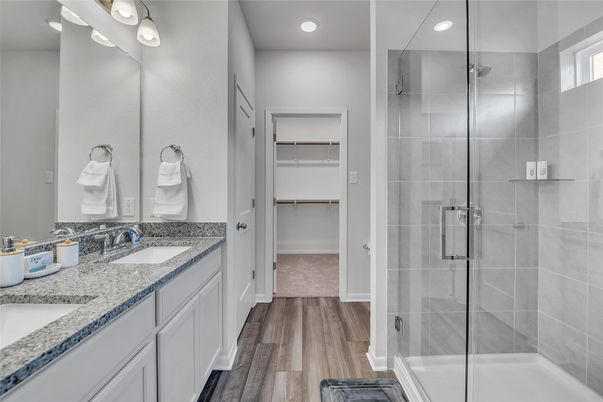 Bathroom, Dual Sink Vanities, Glass Shower, Interior, Recessed Lighting, Walk-in Closets, Wood Texture Flooring