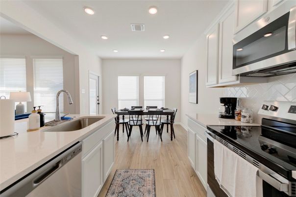 Dining room, Interior, Kitchen, Recessed Lighting, Stainless Steel Appliances, Wood Texture Flooring