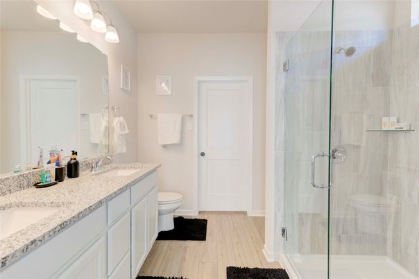 Bathroom, Dual Sink Vanities, Glass Shower, Interior, Wood Texture Flooring