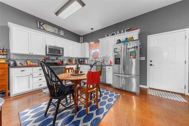 Dining room, Interior, Kitchen, Pendant Lights, Stainless Steel Appliances, Wood Texture Flooring
