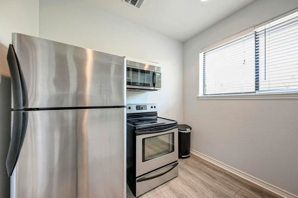 Interior, Kitchen, Recessed Lighting, Stainless Steel Appliances, Wood Texture Flooring