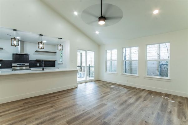 Empty room, Interior, Kitchen, Pendant Lights, Recessed Lighting, Stainless Steel Appliances, Wood Texture Flooring