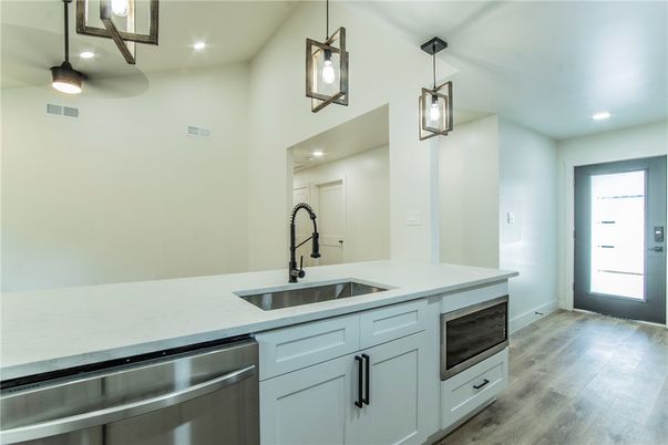 Interior, Kitchen, Pendant Lights, Recessed Lighting, Stainless Steel Appliances, Wood Texture Flooring